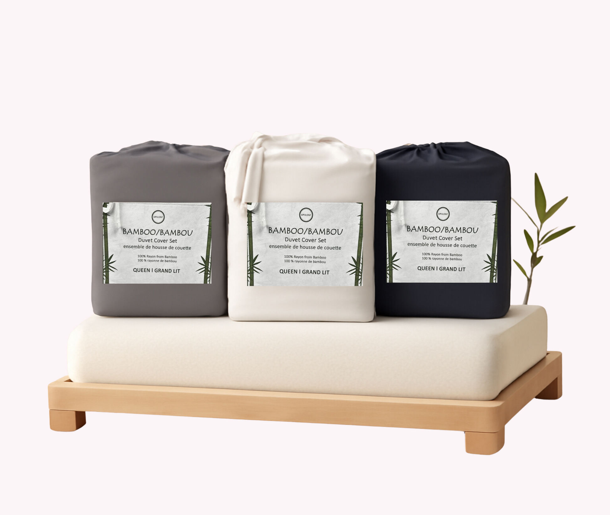 Three bamboo products on a wooden stand with a white background
