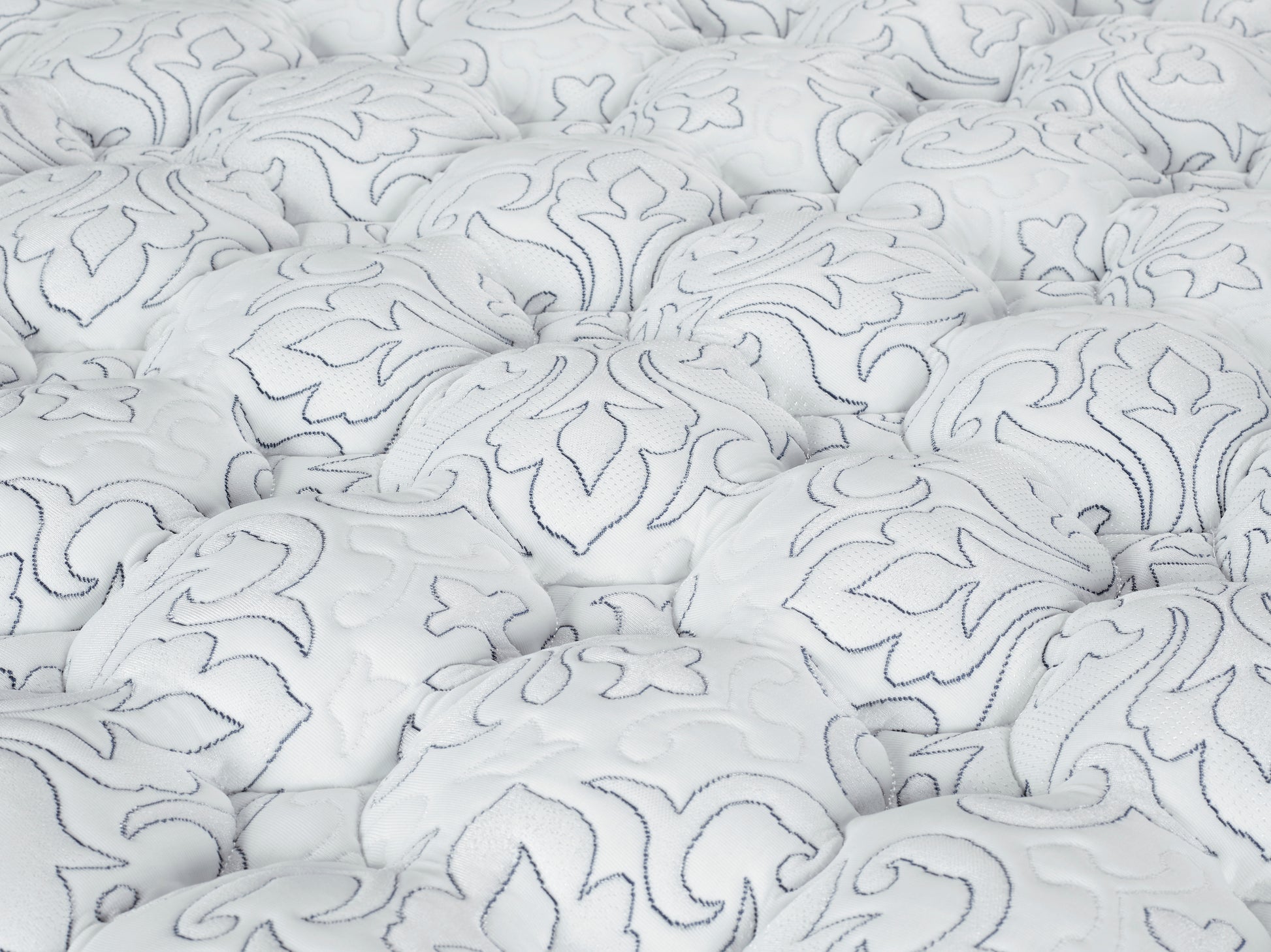 Close-up of textured white fabric with intricate patterns