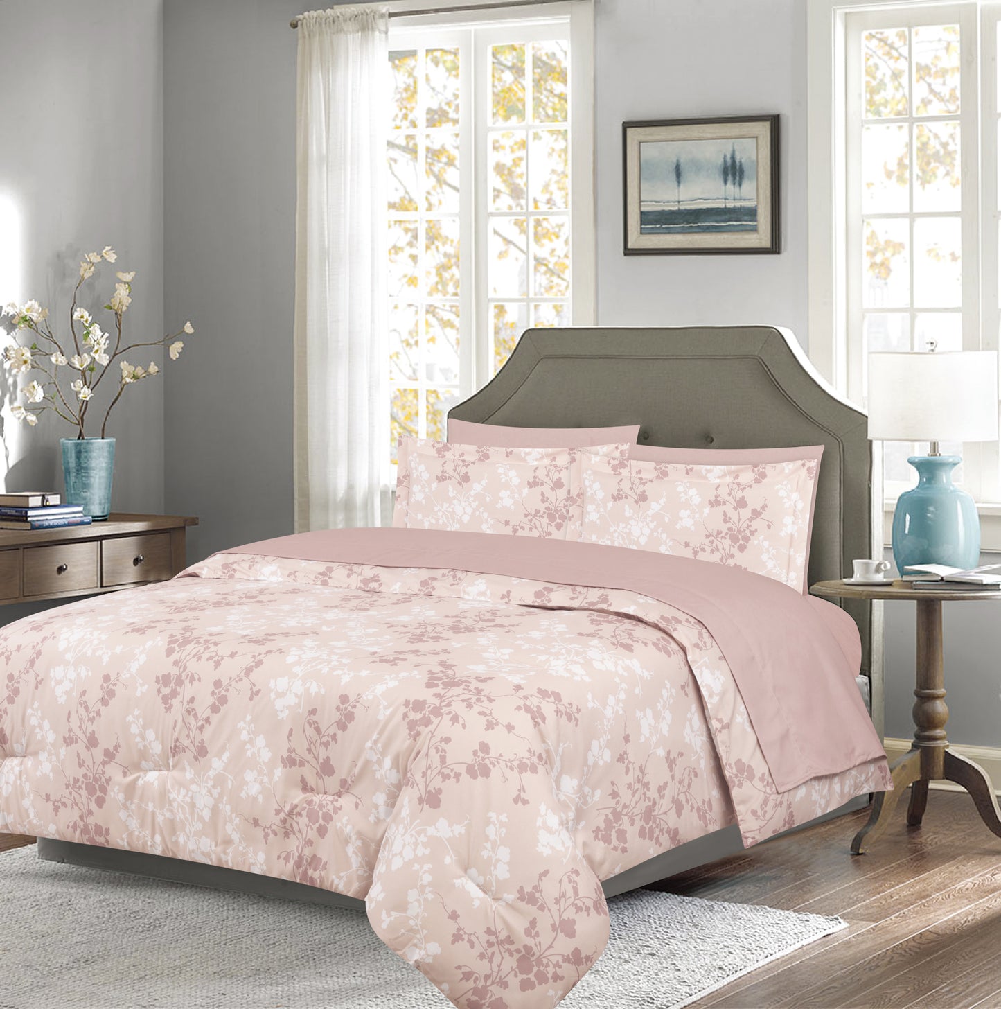 Bedroom with floral bedding and gray headboard