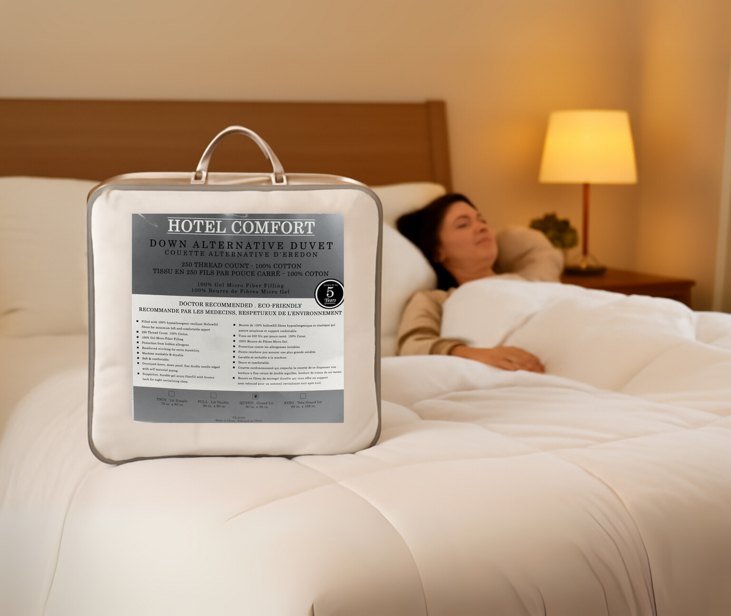 Hotel Comfort duvet in a packaging bag with a person lying in bed in the background