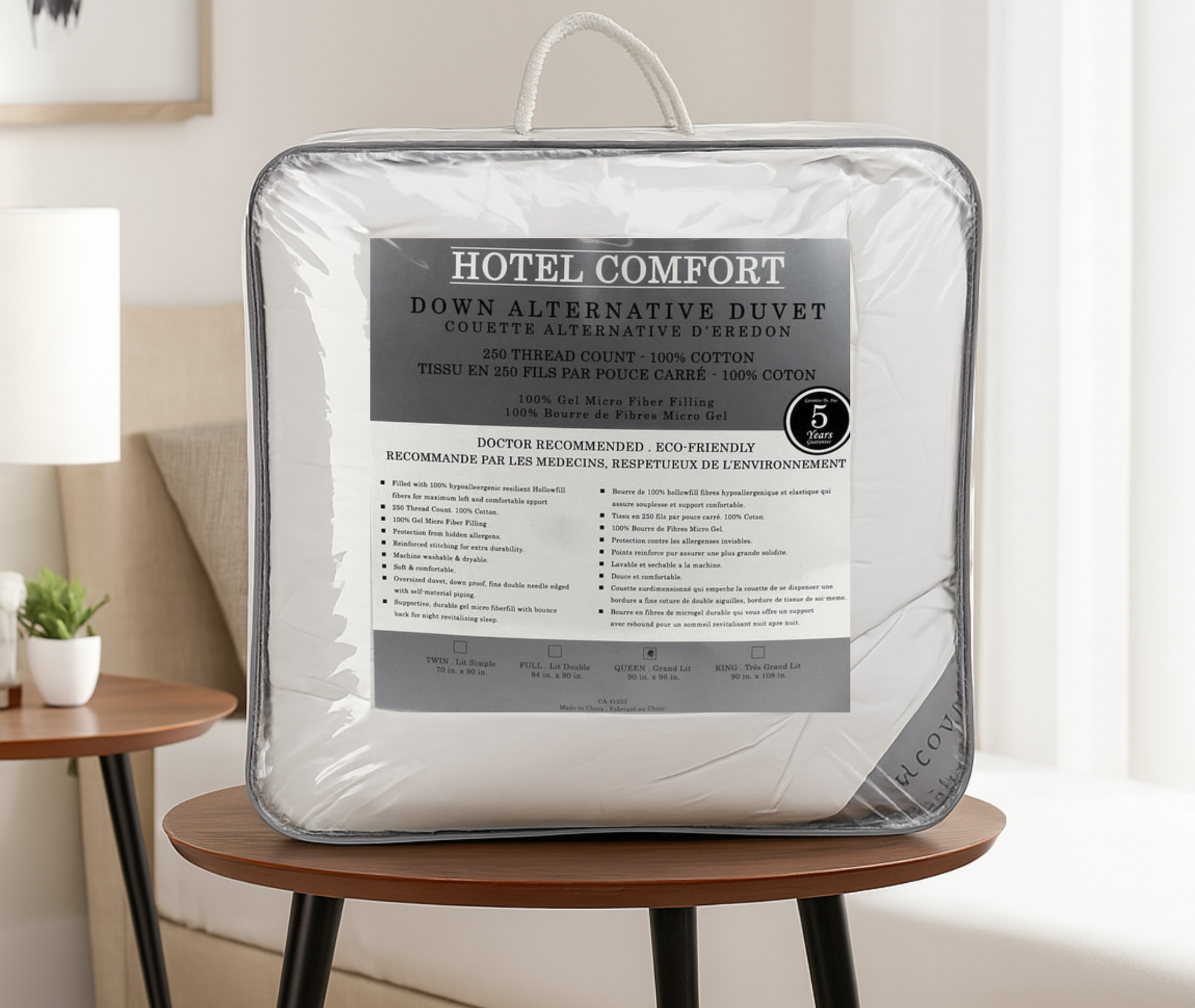 Hotel Comfort down alternative duvet in packaging on a wooden stool with a neutral background