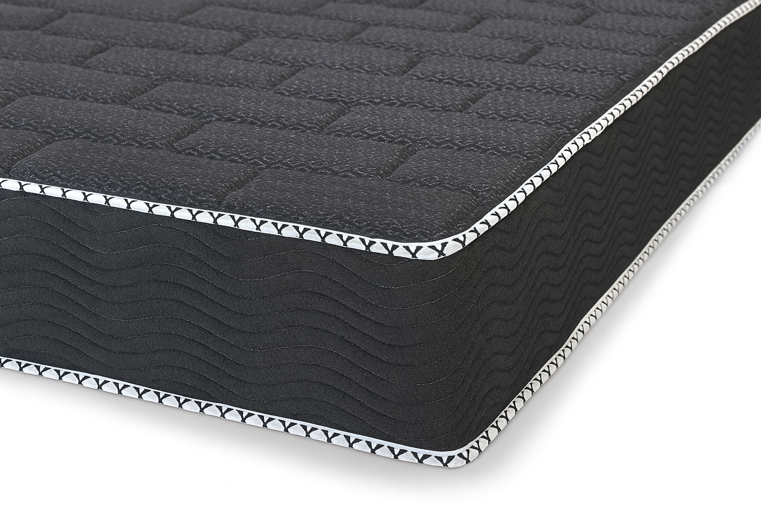 Side view of King Koil Spine Support 11-inch tight top mattress showing detailed side stitching and quilted top pattern.