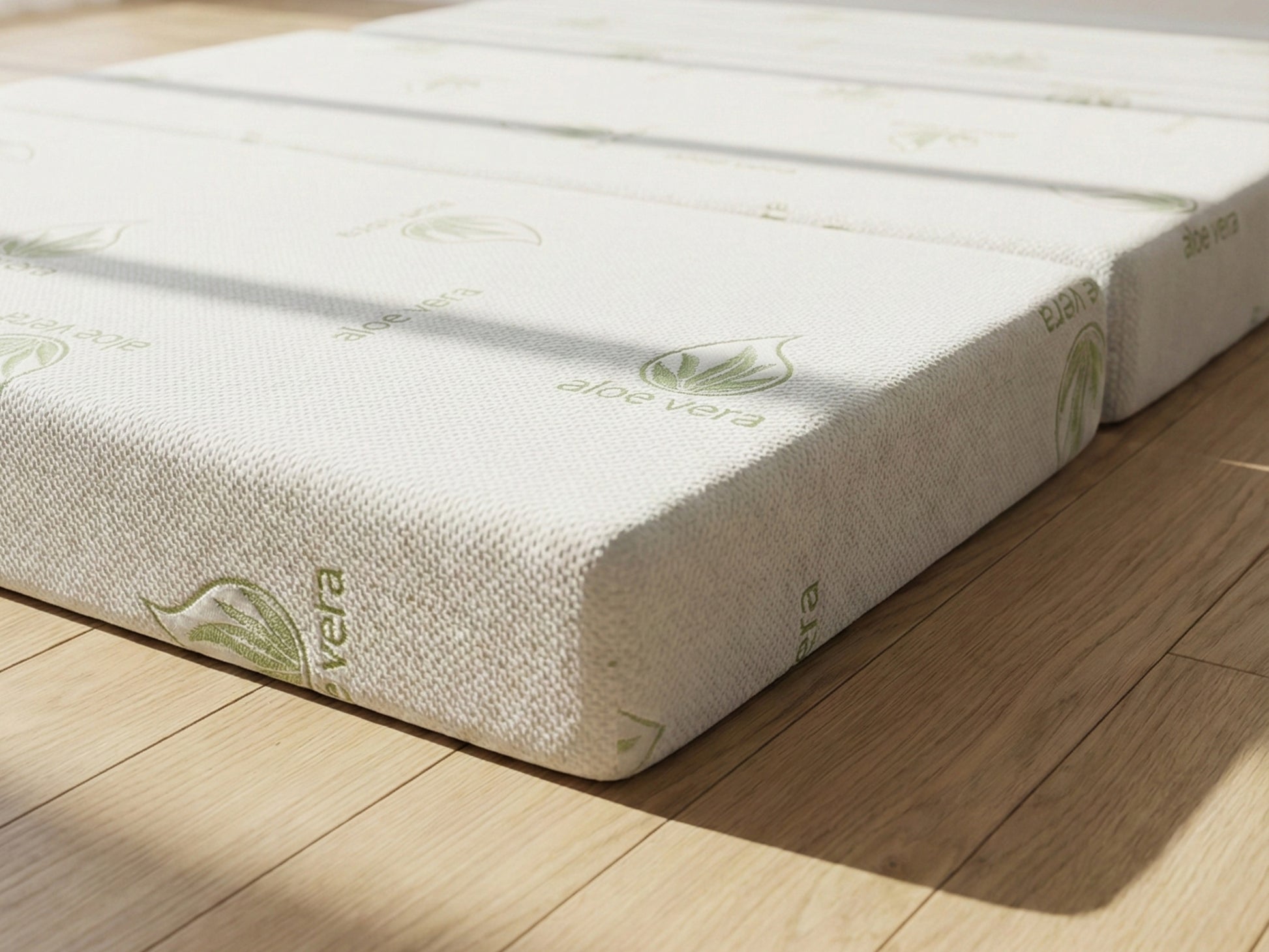 Tri-fold Mattress on a wooden floor