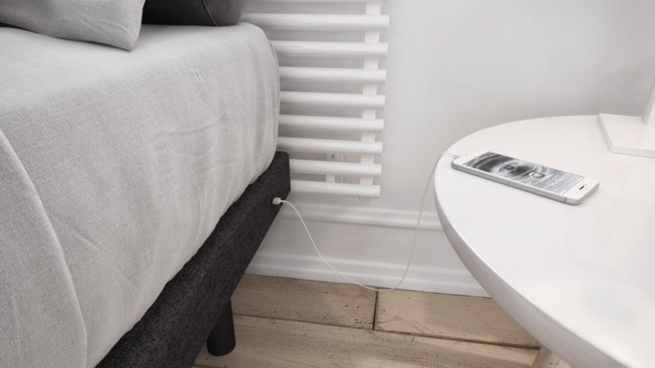 Phone charging on the side of the Beaudoin Reflexx Bed 